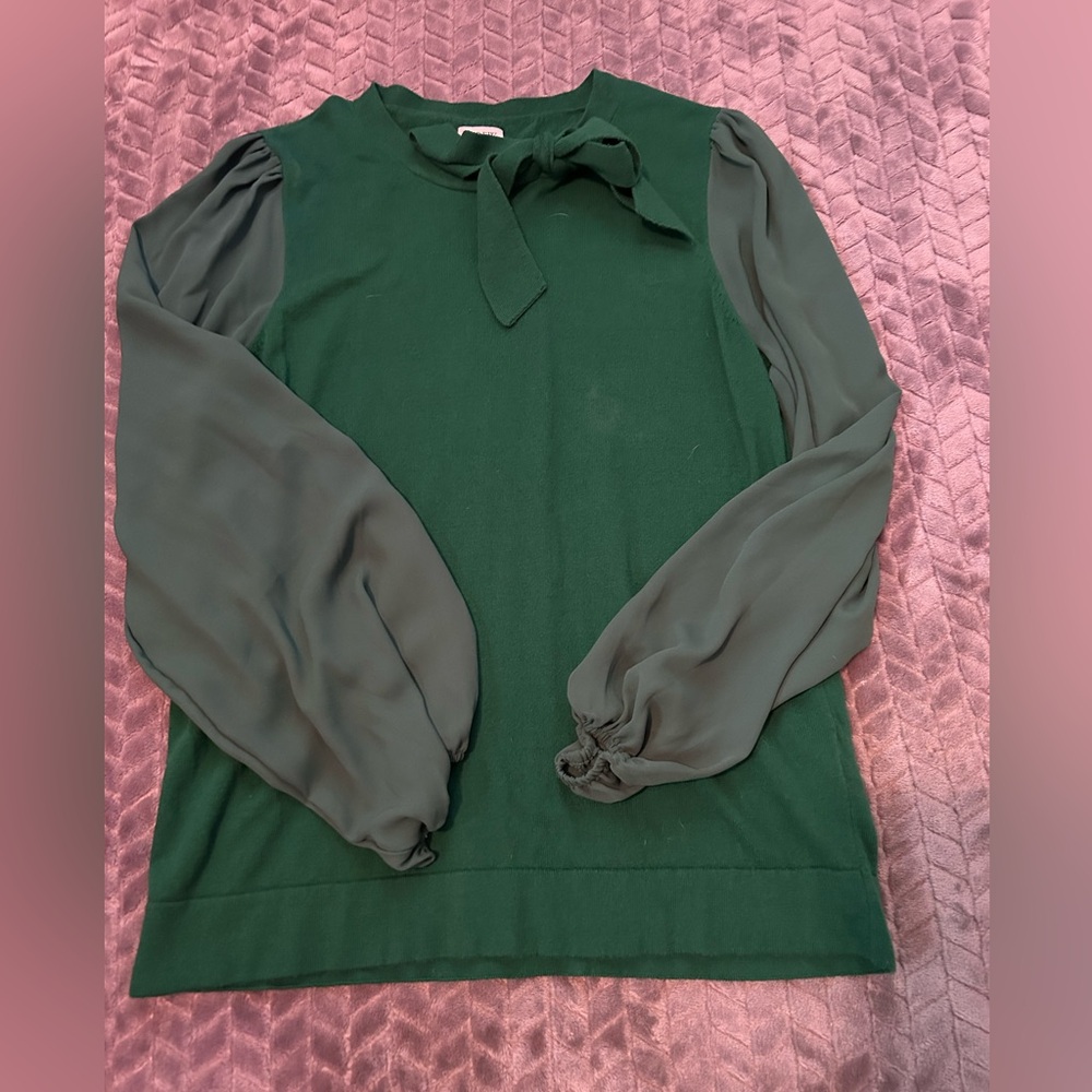 Green sweater with sheer sleeves